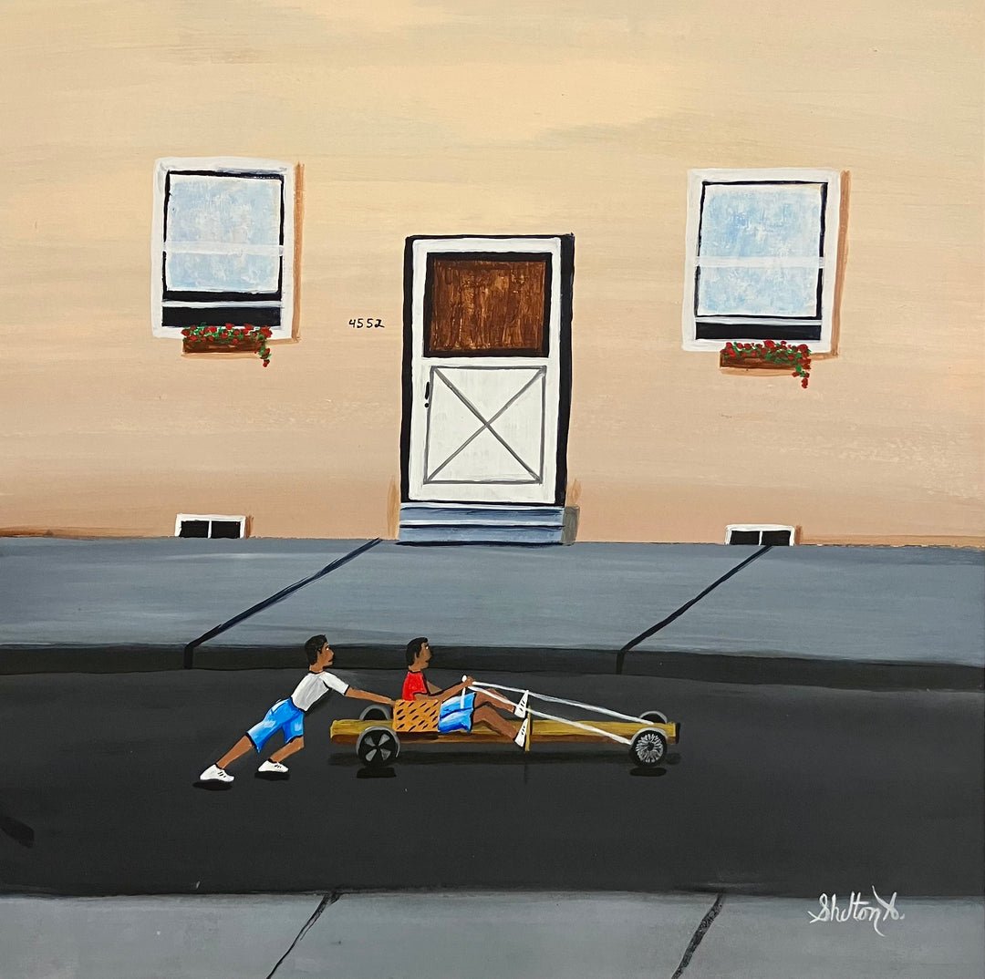 two boys playing race car in street outside of house with door and windows