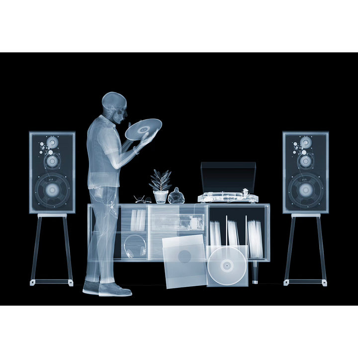 Skeleton man figure x ray photograph with speakers records vinyl collection turn table in blue grey on black background