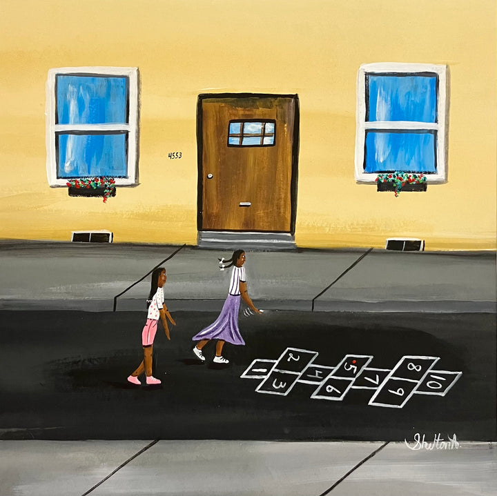 two girls playing hopscotch outside chalk street in front of house with door and windows