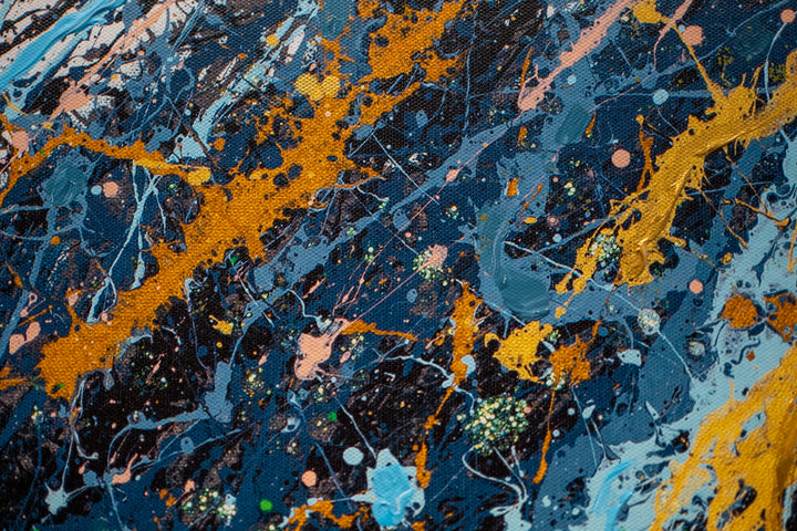 woman side profile face in black and white wearing gold headphones with sea scene flipping hair back in blue black and gold splatter paint on white background