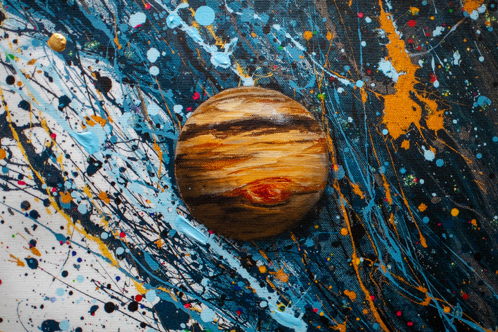 Woman figure looking upwards with eyes closed, wearing headphones with blue splattered hair behind her flying upwards with planets floating around on white background