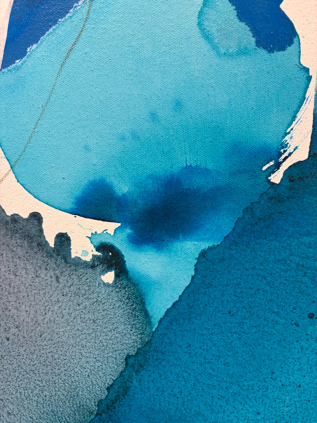 Close-up detail of "Blue Beach Glass 1" by Liz Barber, showing the textured canvas surface and layered blue and gray watercolor pigment