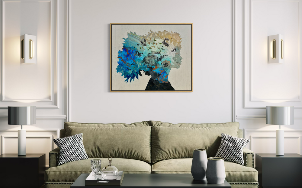 "Born to Bloom" by Christopher Peter — a mixed-media collage painting on canvas depicting a woman's silhouette filled with an explosive botanical dreamscape of blue florals, scattered leaves, gold accents, and layered textures in teal, cobalt, and ivory against a soft plaster-textured background. A breathtaking celebration of feminine strength, nature, and inner beauty. Original contemporary mixed-media botanical portrait painting on canvas available at Morton Contemporary gallery.