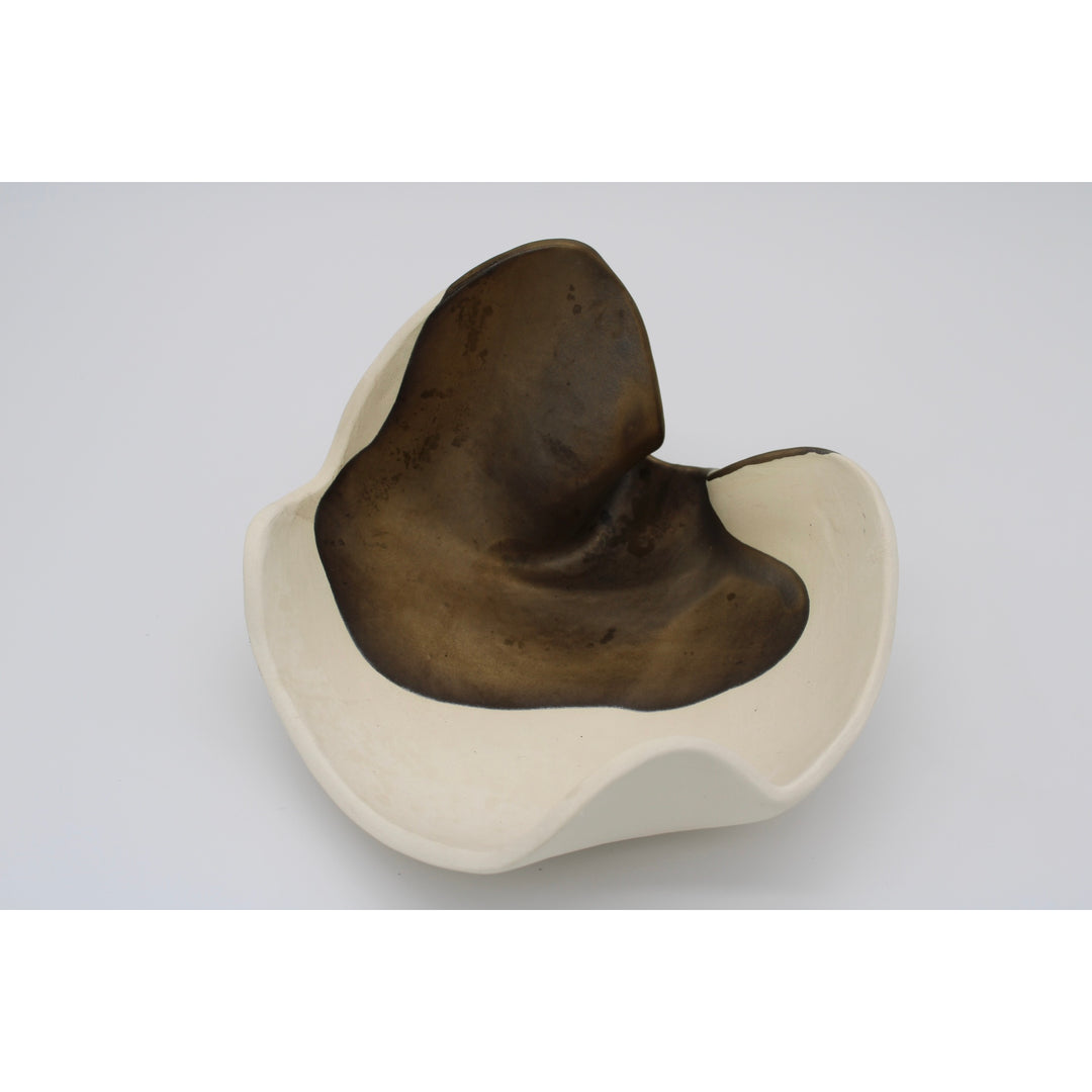 fluid ceramic sculpture with brown bronze and cream