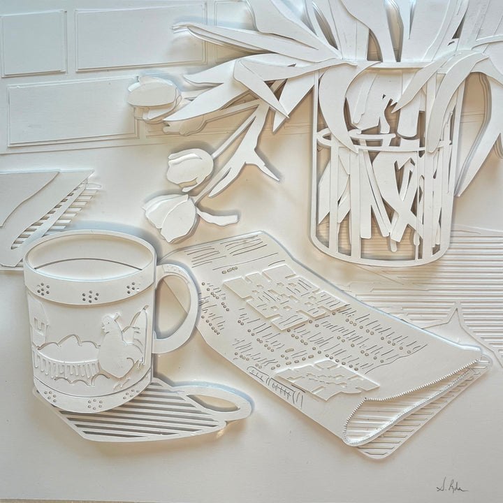 14"x14" paper cut collage featuring a coffee mug and crossword puzzle. 
