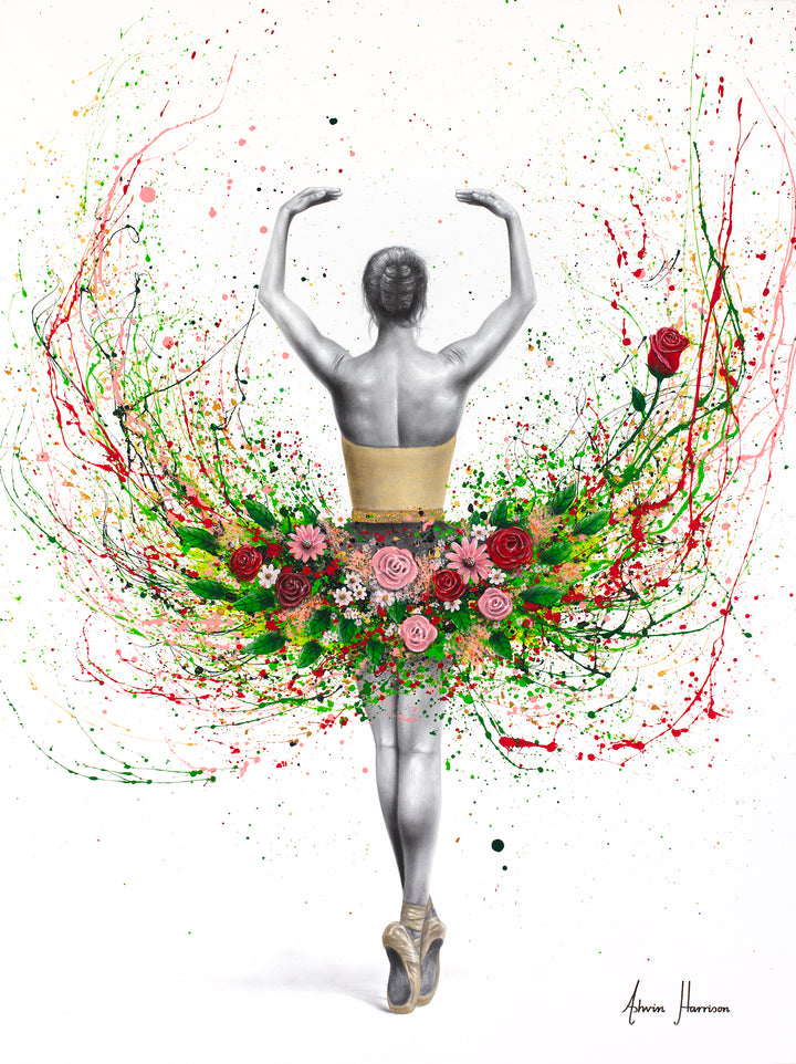 ballerina dancing facing away in black and white arms up wearing tutu of roses and flowers and green eaves on white background