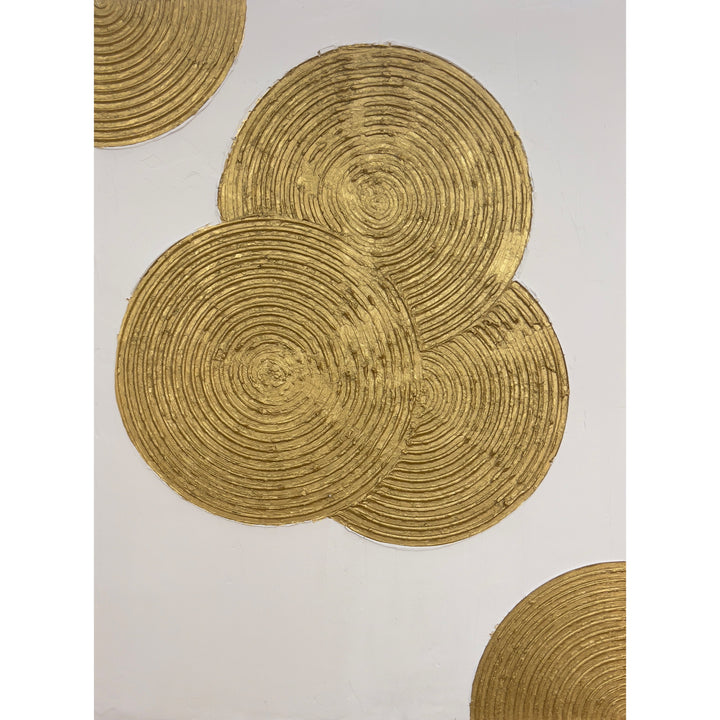 Dilation by Lee in Cerulean. Textured grouping of three spiraled circles overlapping with each other in gold on white background, with two more quarter spiral shapes in top left and bottom right corner