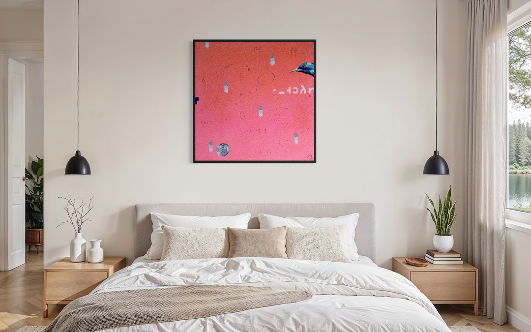 Bob Landstrom, Ethosien, pigmented volcanic rock and acrylic on canvas, 36 x 36 inches. Coral pink background with scattered small white and gray marks, handwritten symbols, an iridescent blue bird head at the right edge, and a gray circle at lower left, shown in a black frame above a bed with a beige upholstered headboard between two black pendant lights.