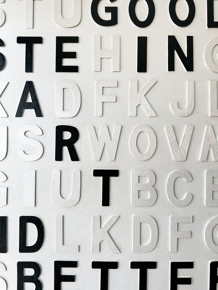 Steffanie Gerkin Have Good Taste White 3D, a contemporary mixed-media text artwork made with wood and acrylic on canvas, featuring raised black and white letters in a bold typographic composition.