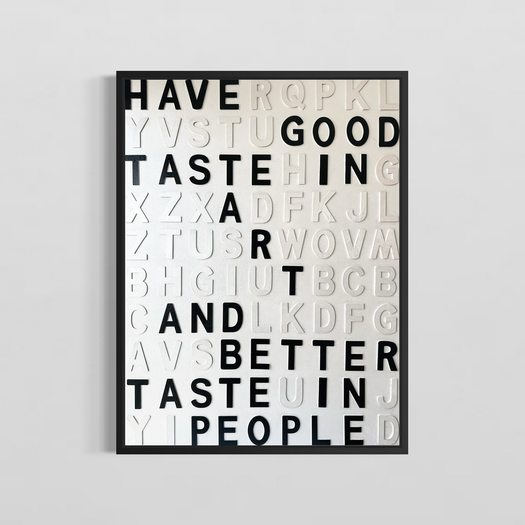 Steffanie Gerkin Have Good Taste White 3D, a contemporary mixed-media text artwork made with wood and acrylic on canvas, featuring raised black and white letters in a bold typographic composition.
