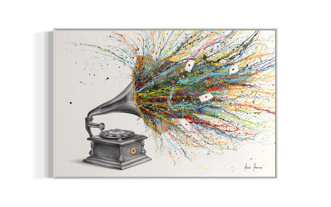 large black and white gramophone with roulette spinning table instead of vinyl, rainbow splatter paint coming out of speaker with loose ace cars on white background