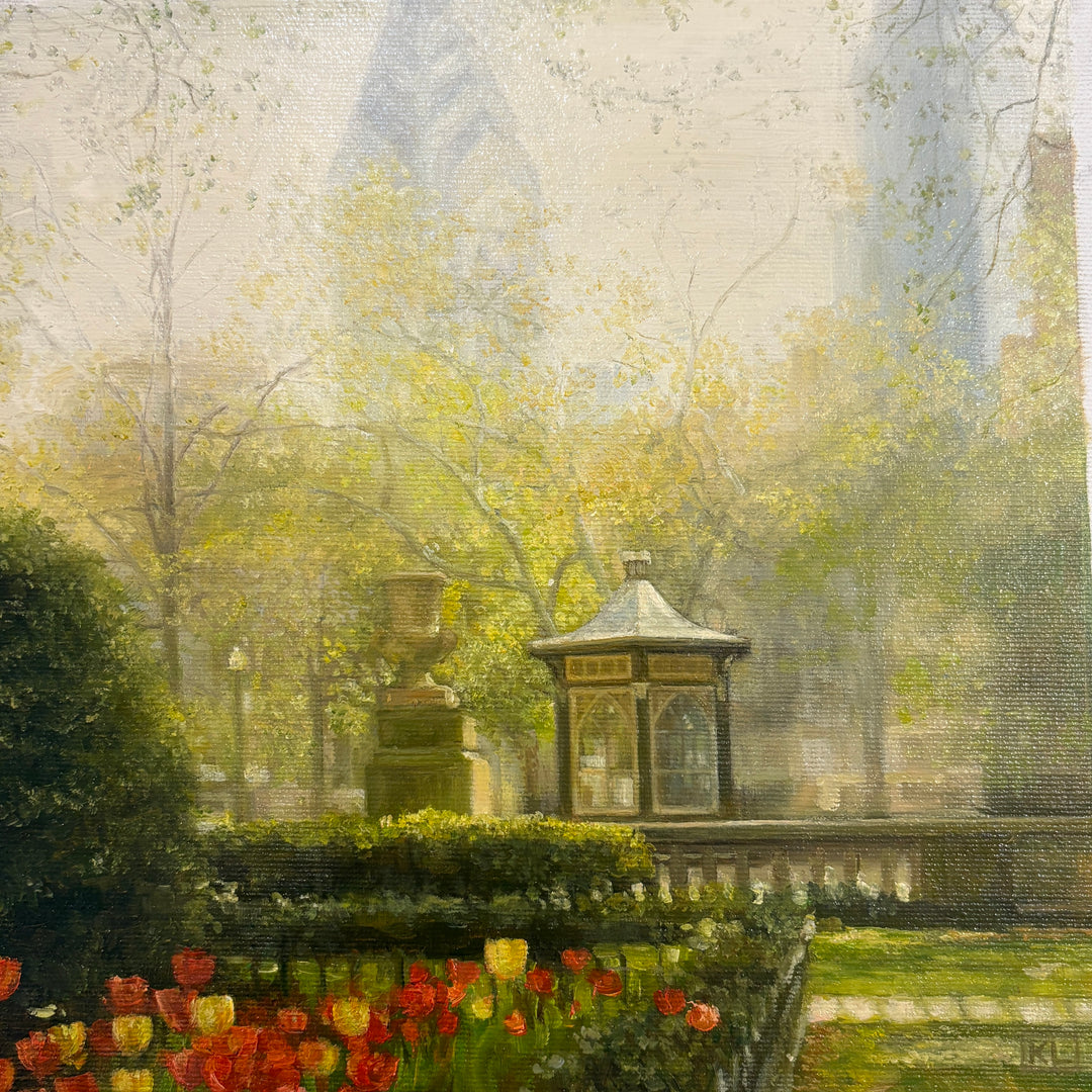 Oil painting of Rittenhouse Square park with liberty place building in foreground. Rich green color of the trees and grass with red tulips
