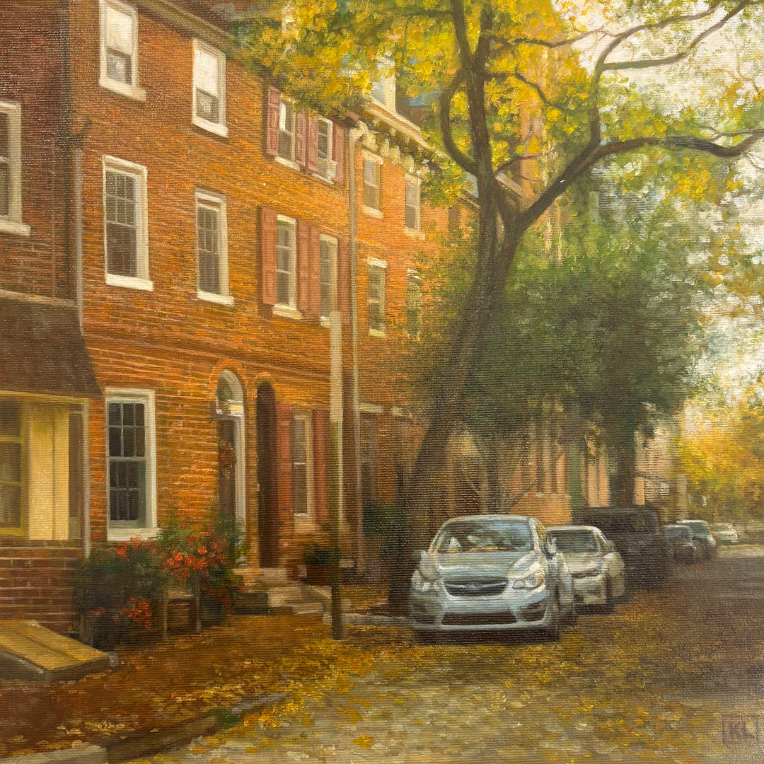 Oil painting of a Philadelphia, PA street in the fall with golden, yellow and green leaves, brick homes