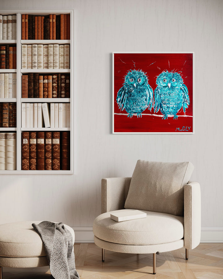 Telepathy hanging on wall in frame above couch and next to bookshelf