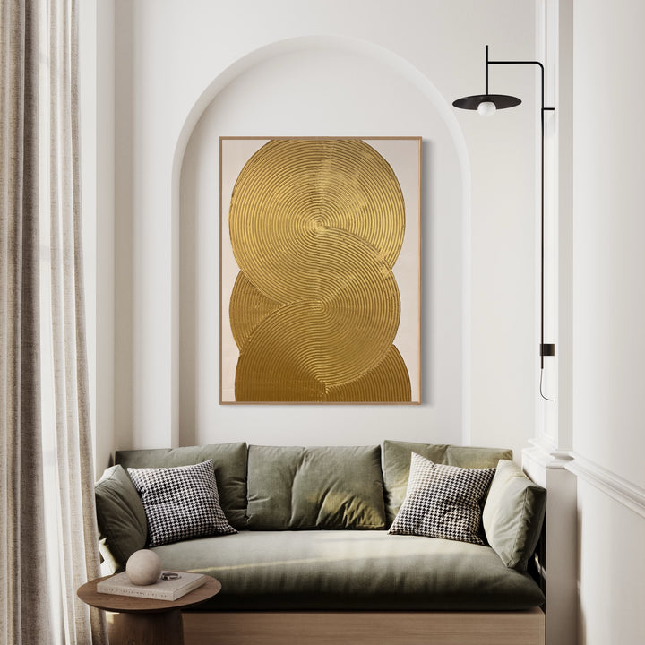 Continuity by Lee in Cerulean. Textured and geometric painting of overlapping gold circles on a white background.
