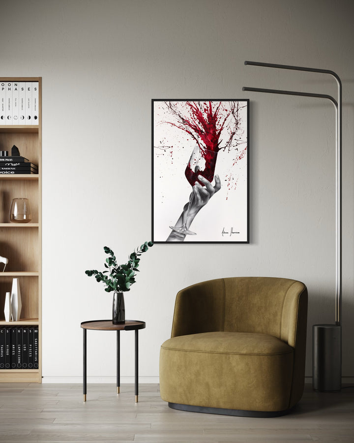 black and white hand holding wine glass red paint splattering out of glass onto background red paint splatter