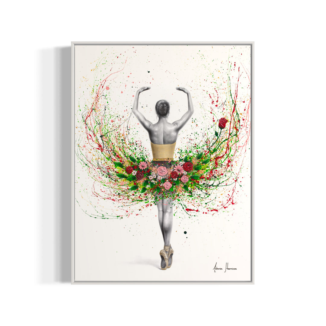 ballerina dancing facing away in black and white arms up wearing tutu of roses and flowers and green eaves on white background