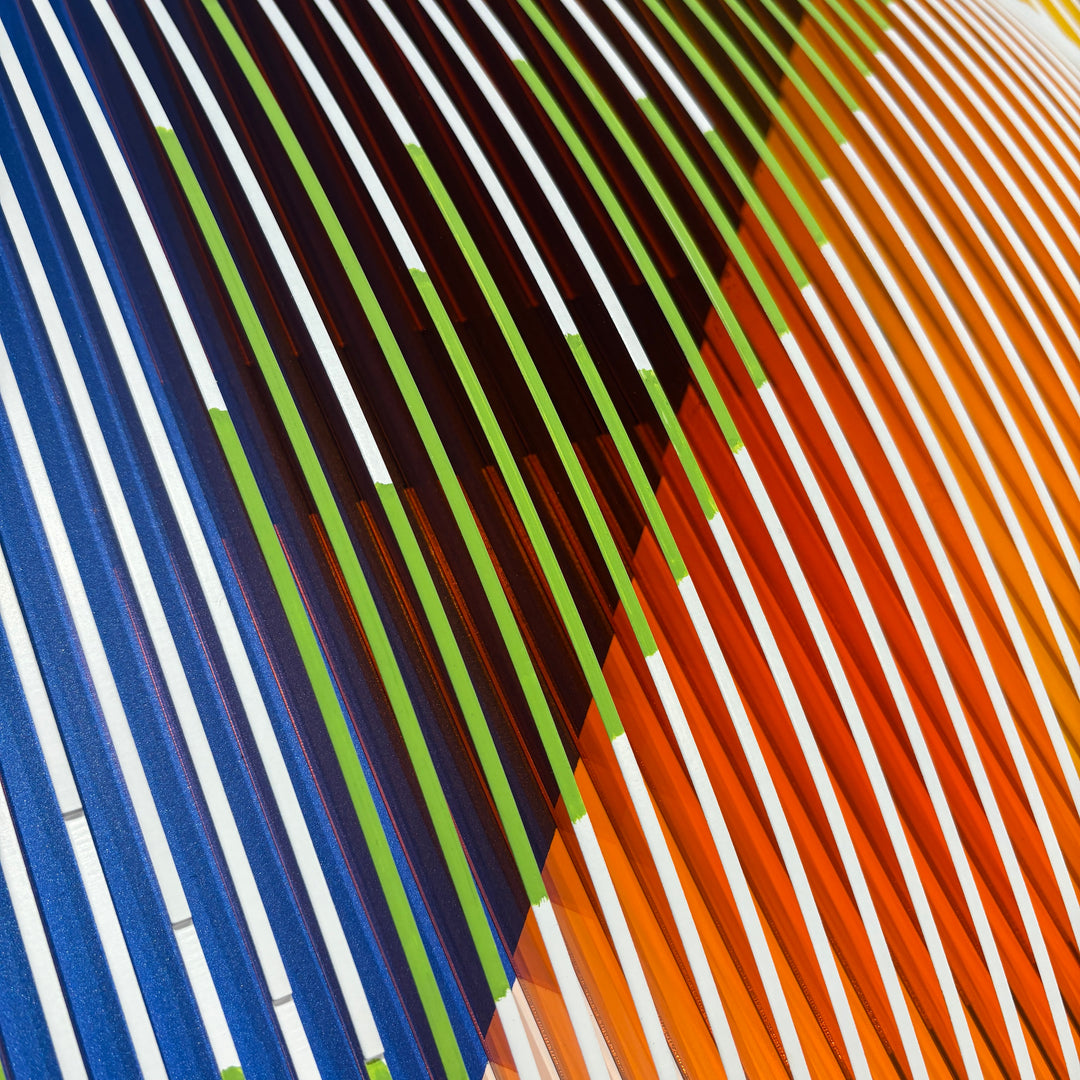 optical illusion line art sculptural plexiglass and acrylic abstract geometric wall hanging in orange pink blue and green with vertical stripes