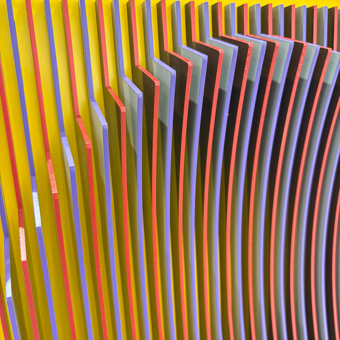 geometric abstract vertical lines concave optical illusion of a circular shape in middle in yellow red and blue