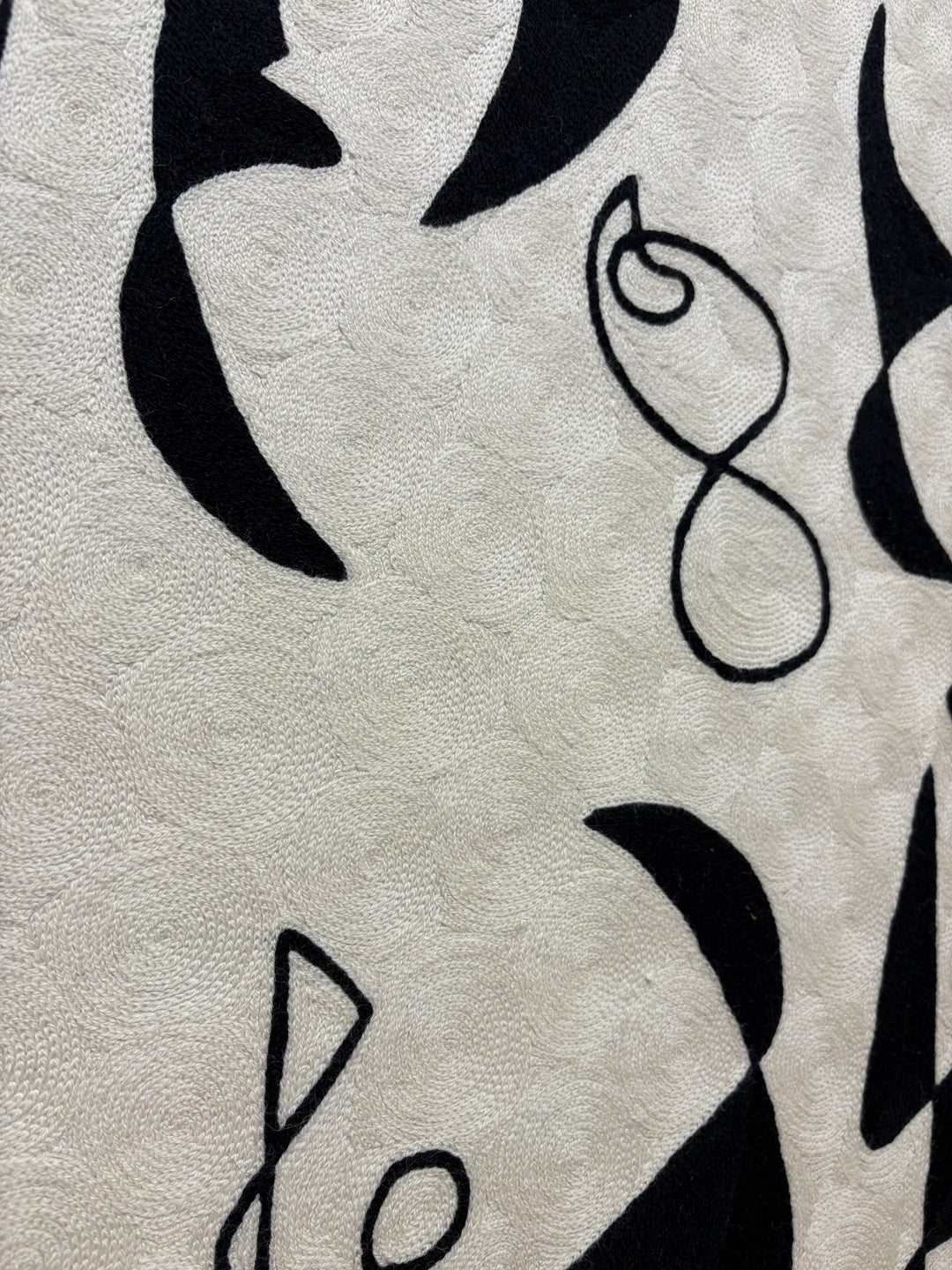 abstract shapes doodles line work in black and white negative space solid heavy chain stitched textile fabric embroidery
