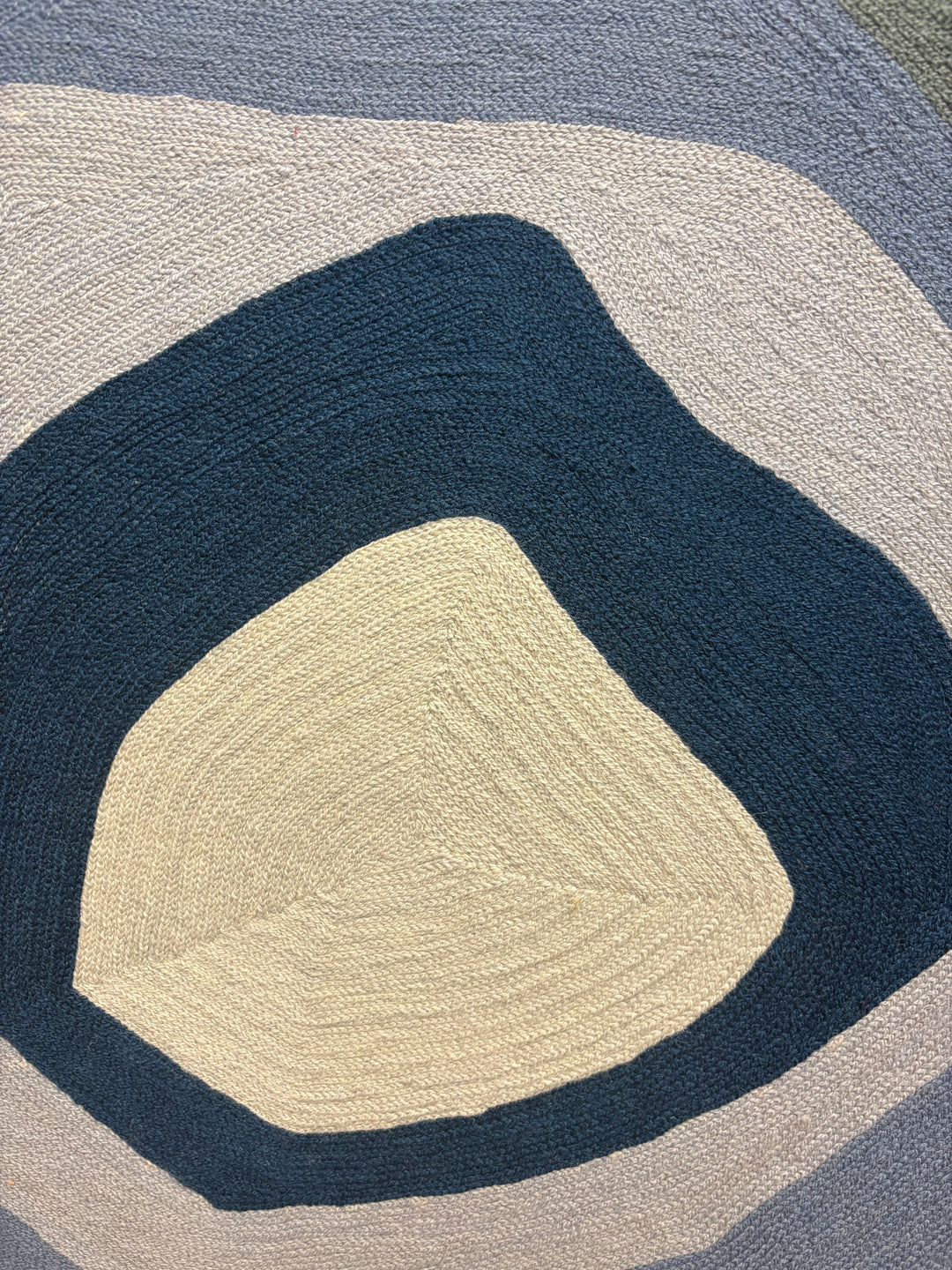 43"x42.5" chain-stitched textile with blue hues in a geometric form. 