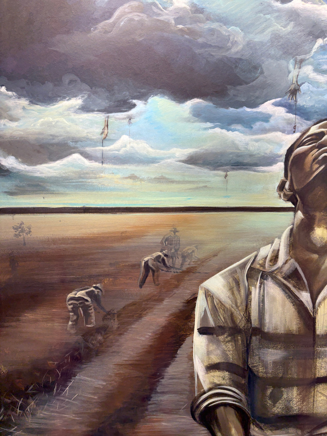 black slave prisoner man figurative portrait with chains in field dark and gloomy acrylic painting in browns and blues