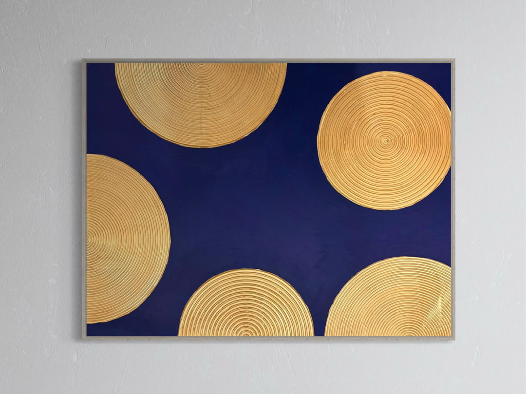 Indigo Awakening I by Lee In Cerulean. Acrylic painting of golden circles with smaller circles inside semi circles half off canvas on dark blue background.