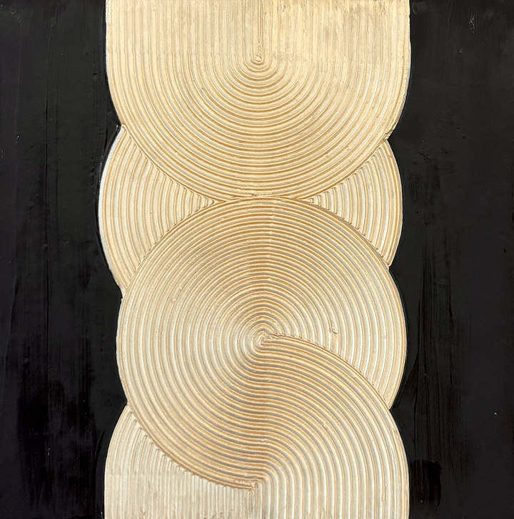 gold circular shapes with rigged texture in a vertical orientation on black background