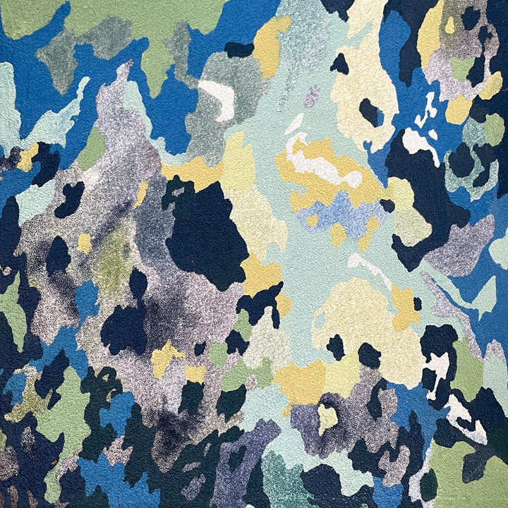abstract shapes in blues greens and yellows resembling tree bark texture on pumice with oil paint