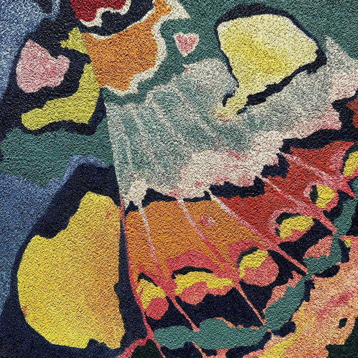close up view abstracted butterfly insect wing on textured surface multicolor in oil on pumice