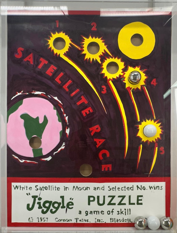 mixed media puzzle collage in plexiglass satellite race kid game nostalgia vintage retro ball jiggle puzzle graphic 
