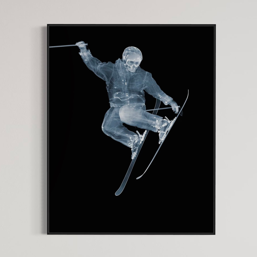 Framed Chromaluxe x-ray photograph by Nick Veasey of a skeleton skier jumping on a black background