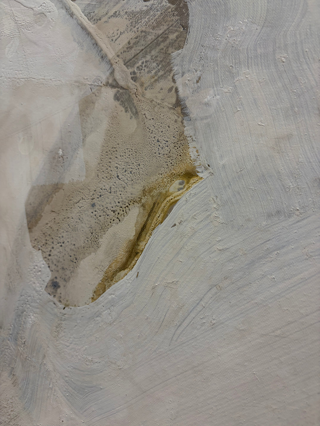 Close-up detail of "Summer Light 3" by Liz Barber, showing textured white and golden ochre pigment on canvas