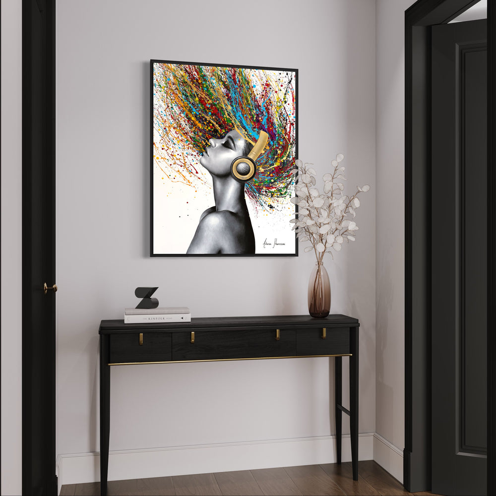 Beautiful woman wearing headphones, painted in black and white coconut charcoal with colorful splattered paint as hair