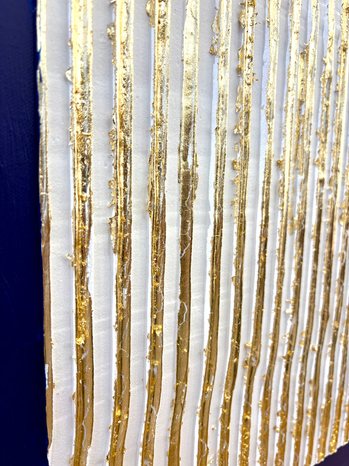 minimal geometric abstract sculptural work with joint compound texture dimension white rigid triangle with gold leaf detail on blue background