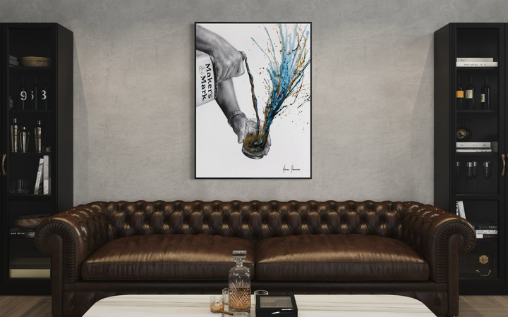 black and white realism arm hand pouring makers mark whisky into glass splatter paint expressionism in blue and gold