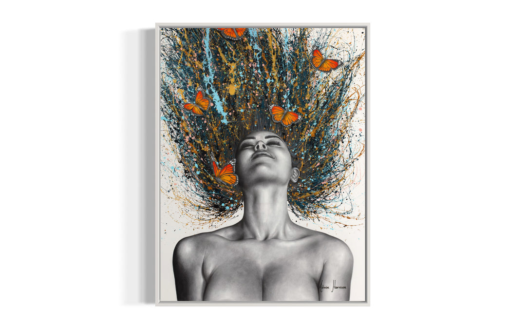 black and white woman flipping hair back with gold blue and black splatter paint, orange monarch butterflies in hair on white background