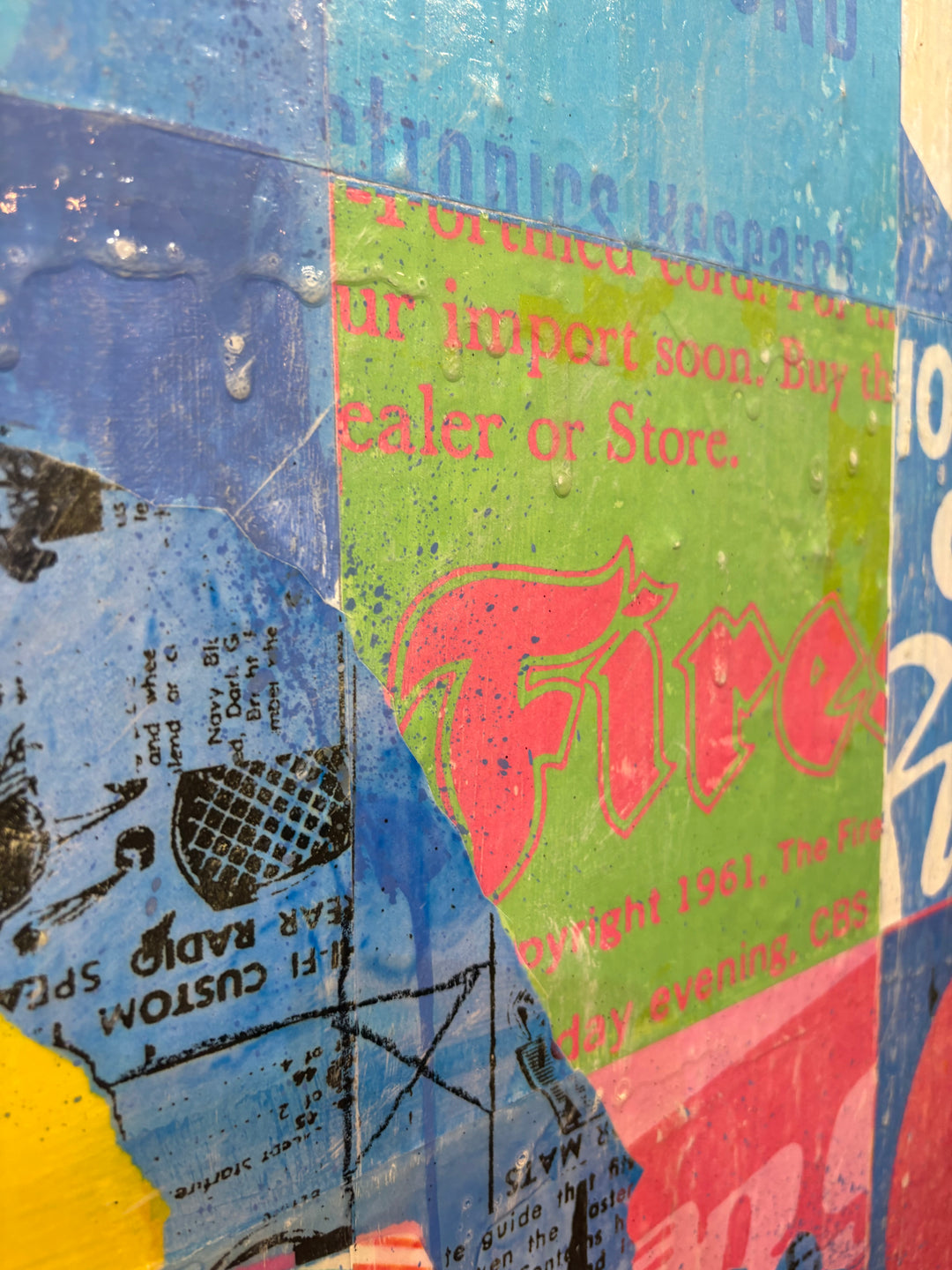 XOXO by Jon Davenport — angled detail of Neo-Pop mixed media painting showing vintage newspaper collage with "Fire" text and retro advertising fragments