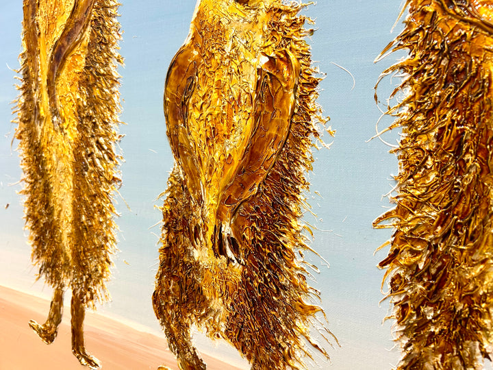 30” x 30” painting by French artist Moogly of three goldish-brown merecats. The two merecats on the sides look left and right while the smallest one in the middle looks straightforward with a light blue background. The merecats are made out of resin, giving them a textured and shiny finish. Their eyes are made out of washers that the artist has adhered to the canvas.