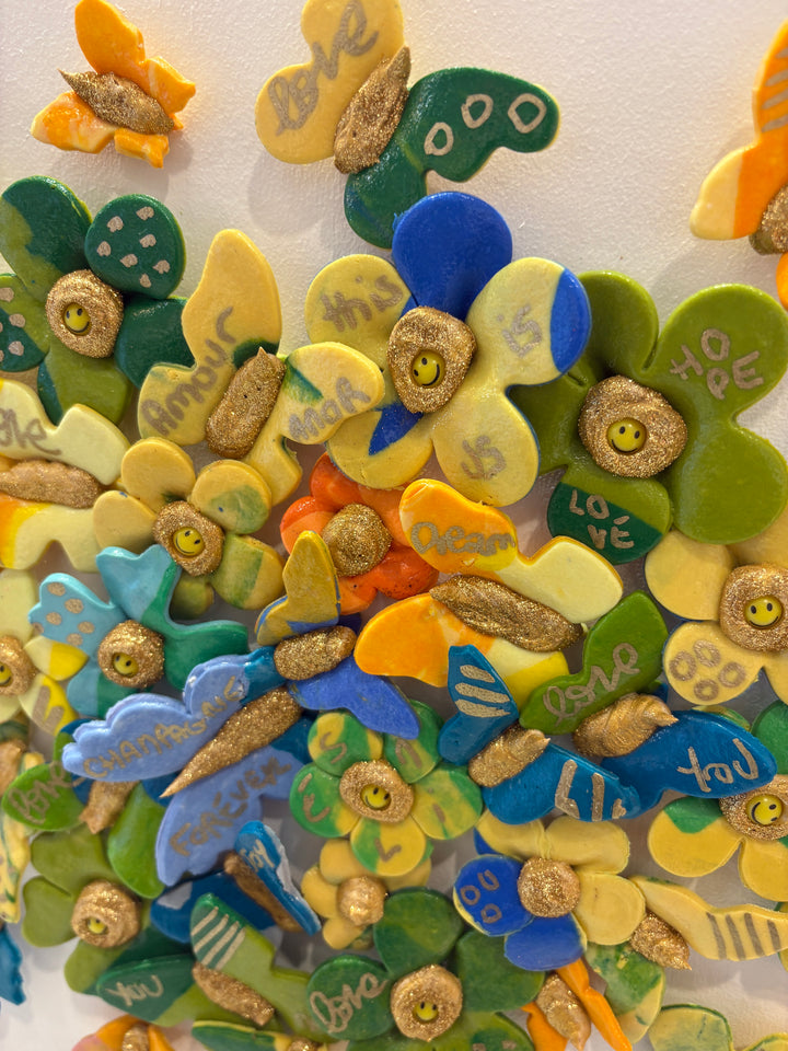 3 dimensional textured artwork of butterflies with text and floral collage on white background