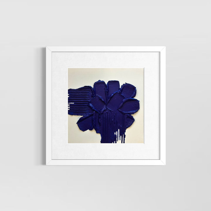 Layered blue joint compound with lines scraped out on sides on white background
